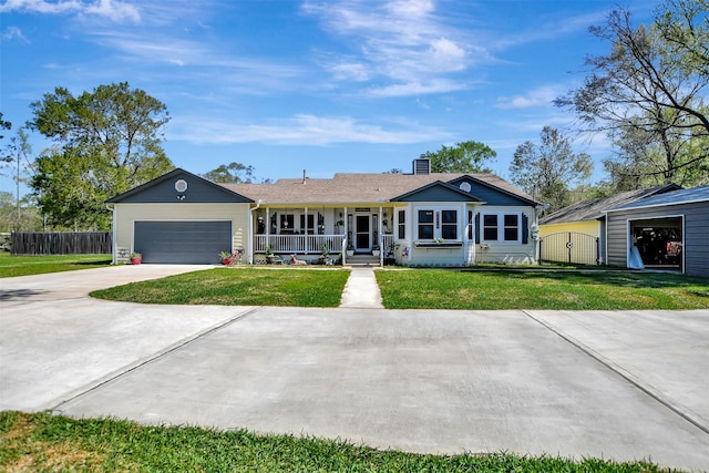 single story home featuring a porch, fence, a front yard, and concrete driveway
