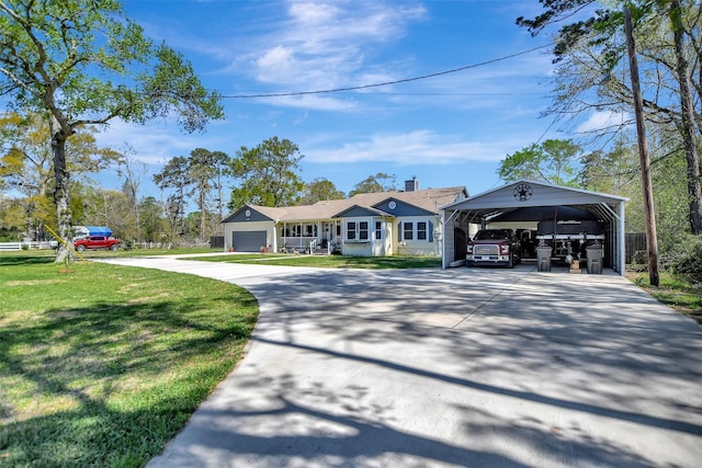 view of front facade with a detached carport, driveway, a front lawn, and a garage