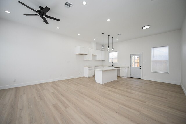 8203 Sparta St Unit B, Houston, TX 77028 - unfurnished living room with baseboards, light wood finished floors, visible vents, and recessed lighting