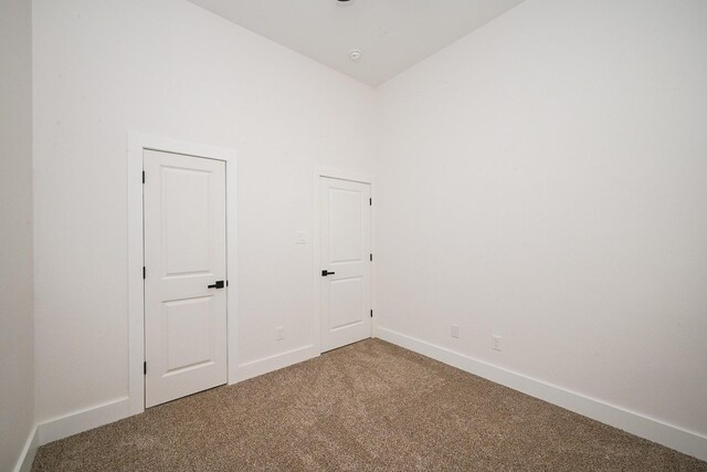 8203 Sparta St Unit B, Houston, TX 77028 - unfurnished bedroom featuring vaulted ceiling, carpet floors, and baseboards