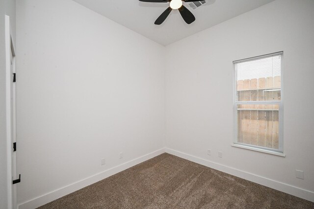 8203 Sparta St Unit B, Houston, TX 77028 - unfurnished room featuring dark carpet, visible vents, baseboards, and ceiling fan