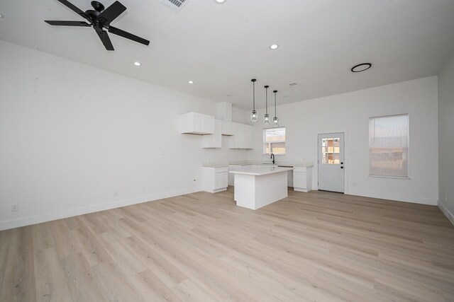 8203 Sparta St Unit B, Houston, TX 77028 - unfurnished living room featuring recessed lighting, light wood-style flooring, baseboards, and ceiling fan
