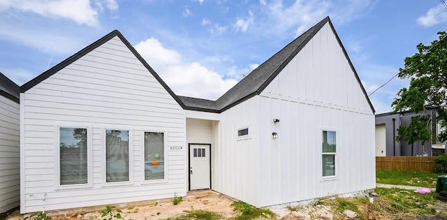 8203 Sparta St Unit B, Houston, TX 77028 - rear view of house featuring board and batten siding and fence