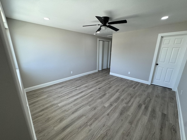 9805 Fabiola Dr, Houston, TX 77075 - unfurnished bedroom with recessed lighting, a closet, baseboards, and wood finished floors