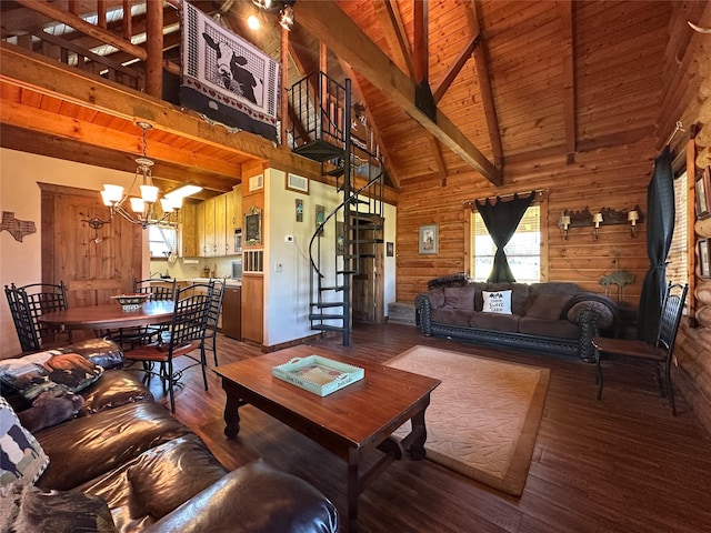 living area with stairs, wooden ceiling, beamed ceiling, a notable chandelier, and wood finished floors