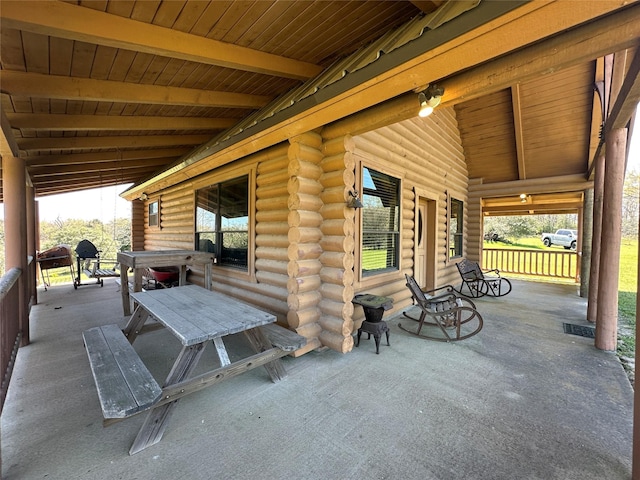view of patio featuring covered porch and visible vents