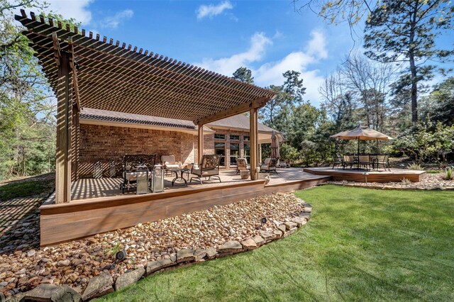 exterior space with a pergola and a yard