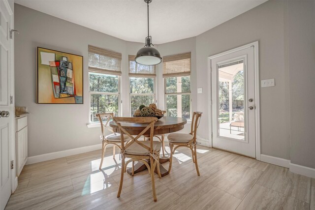 dining area featuring baseboards