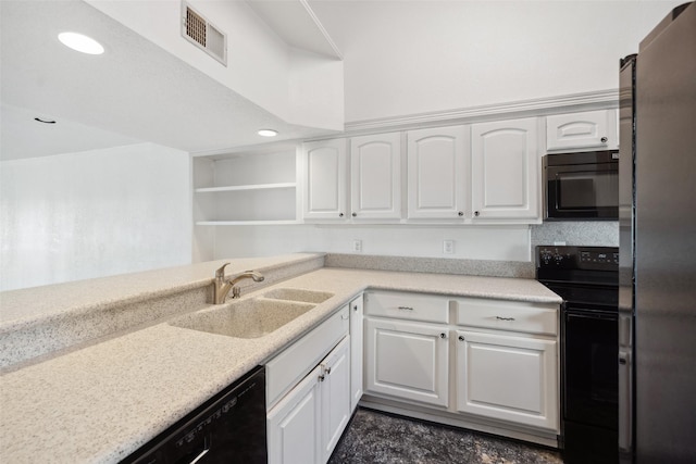 kitchen with black appliances, a sink, open shelves, white cabinetry, and recessed lighting