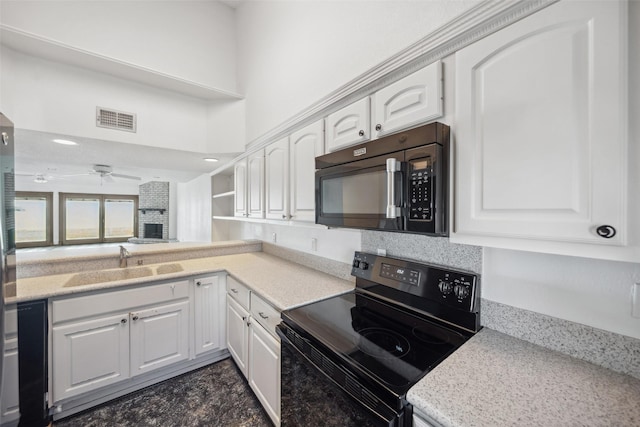 kitchen featuring black appliances, a sink, white cabinetry, a ceiling fan, and open shelves