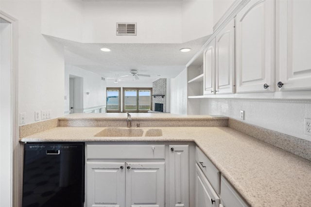 kitchen with black dishwasher, a sink, ceiling fan, white cabinets, and recessed lighting