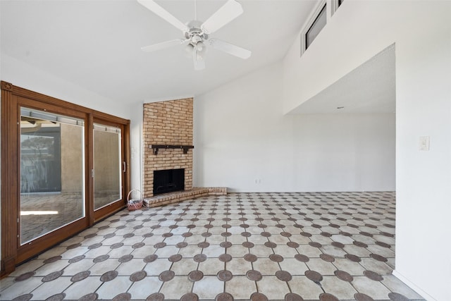 unfurnished living room featuring lofted ceiling, a brick fireplace, and ceiling fan