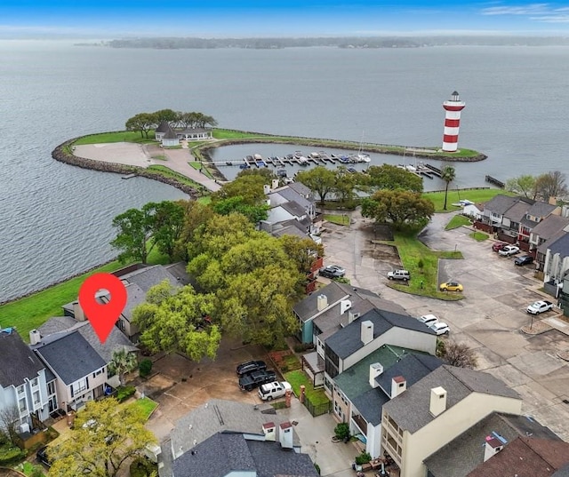aerial perspective of suburban area with a large body of water