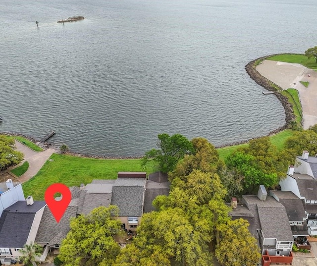 aerial view of residential area with a nearby body of water