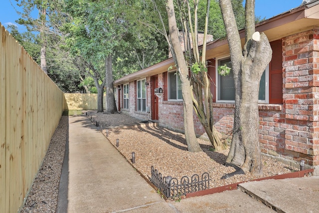 4006 Blalock Rd, Houston, TX 77080 - view of side of property featuring a fenced backyard and brick siding