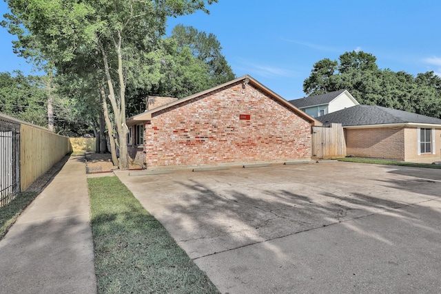 4006 Blalock Rd, Houston, TX 77080 - view of property exterior featuring brick siding and fence