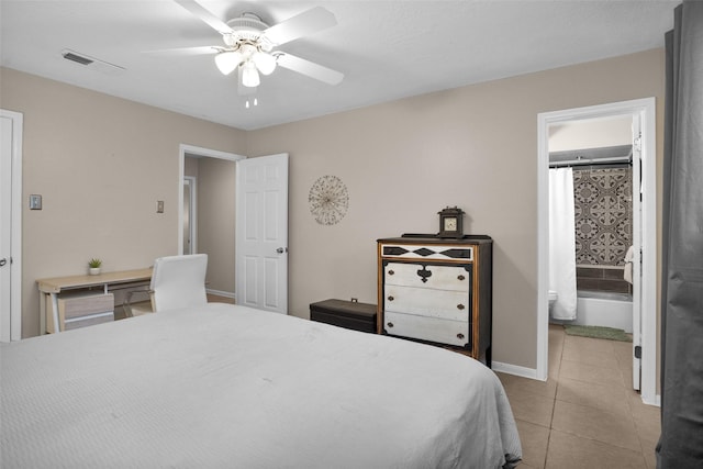 4006 Blalock Rd, Houston, TX 77080 - bedroom with tile patterned floors, ensuite bathroom, visible vents, baseboards, and a ceiling fan