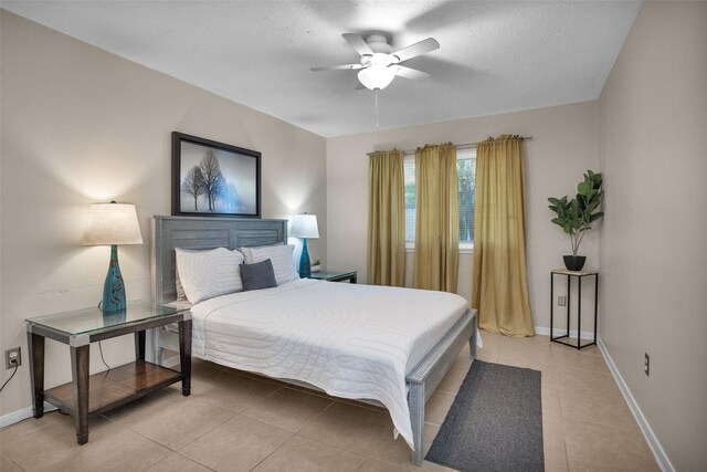 4006 Blalock Rd, Houston, TX 77080 - bedroom with a ceiling fan, baseboards, and light tile patterned floors