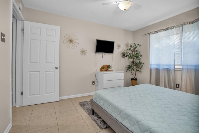 4006 Blalock Rd, Houston, TX 77080 - bedroom with baseboards, ceiling fan, and light tile patterned floors