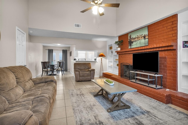 4006 Blalock Rd, Houston, TX 77080 - living area featuring tile patterned floors, visible vents, a towering ceiling, built in features, and ceiling fan