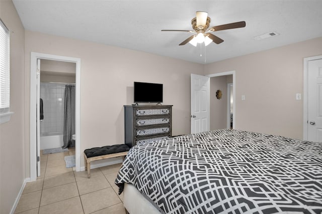 4006 Blalock Rd, Houston, TX 77080 - bedroom featuring a ceiling fan, ensuite bathroom, light tile patterned floors, baseboards, and visible vents