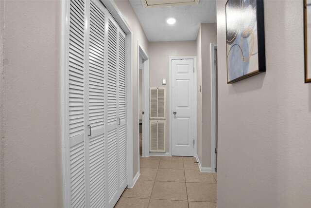 4006 Blalock Rd, Houston, TX 77080 - hall with light tile patterned flooring, visible vents, and baseboards