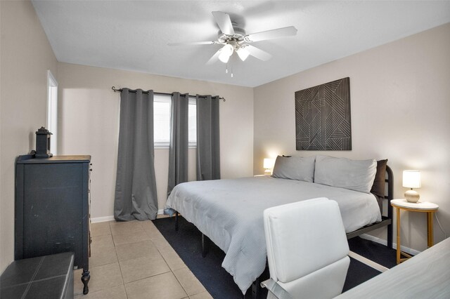4006 Blalock Rd, Houston, TX 77080 - bedroom with light tile patterned flooring, baseboards, and ceiling fan