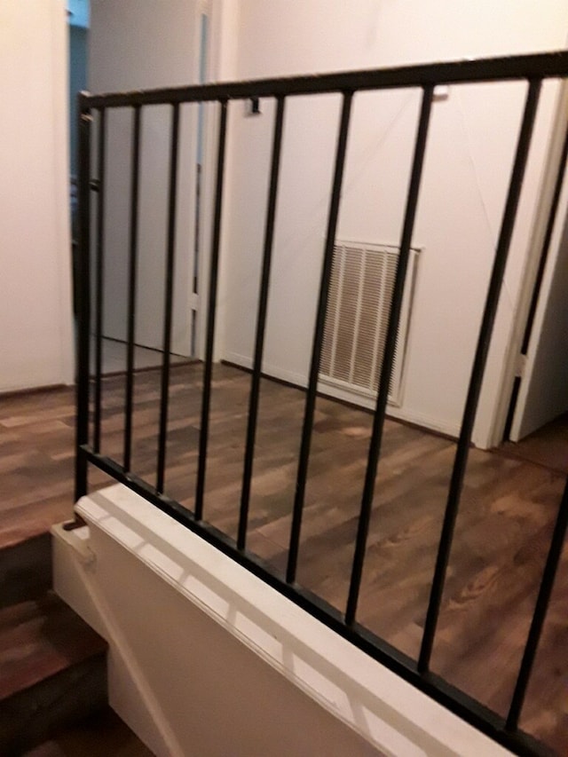 stairs with wood finished floors