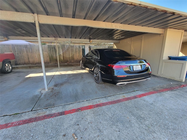 covered parking lot with fence