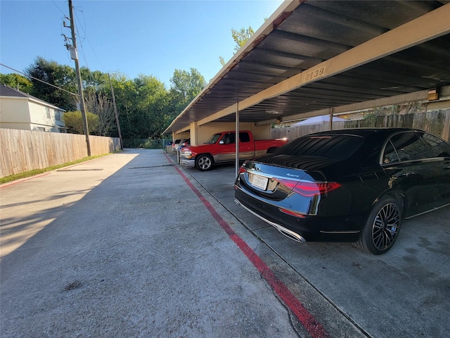 covered parking lot with fence