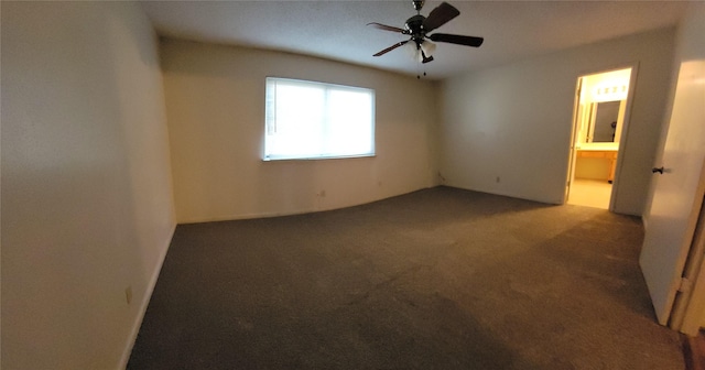 carpeted empty room featuring a ceiling fan