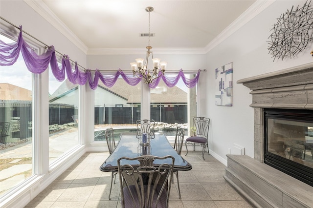 98 Victoria Dr W, Montgomery, TX 77356 - tiled dining area featuring a notable chandelier, visible vents, a glass covered fireplace, and crown molding