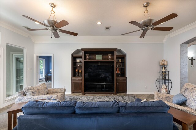 98 Victoria Dr W, Montgomery, TX 77356 - living area with wood finished floors, visible vents, ornamental molding, and ceiling fan