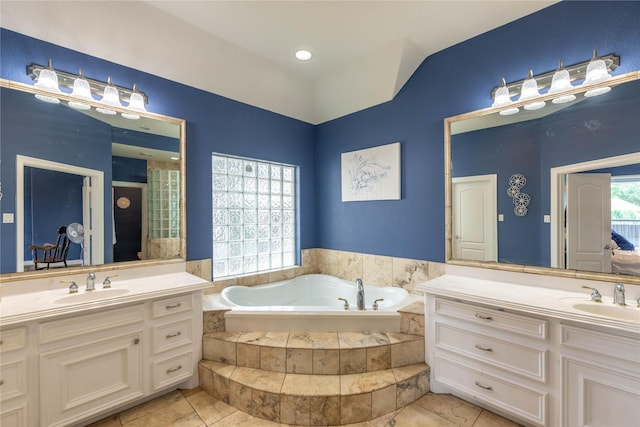 98 Victoria Dr W, Montgomery, TX 77356 - bathroom featuring a sink, a garden tub, and two vanities