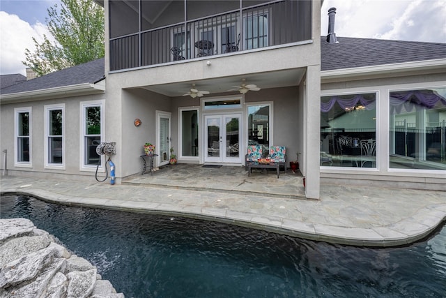 98 Victoria Dr W, Montgomery, TX 77356 - back of property featuring a balcony, a patio, ceiling fan, a shingled roof, and french doors