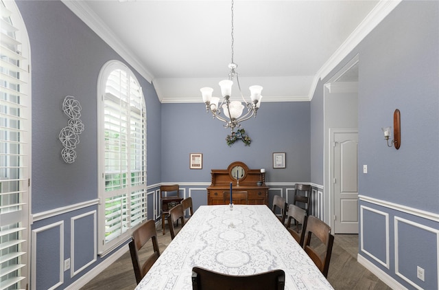 98 Victoria Dr W, Montgomery, TX 77356 - dining space featuring a wainscoted wall, dark wood finished floors, a decorative wall, ornamental molding, and an inviting chandelier