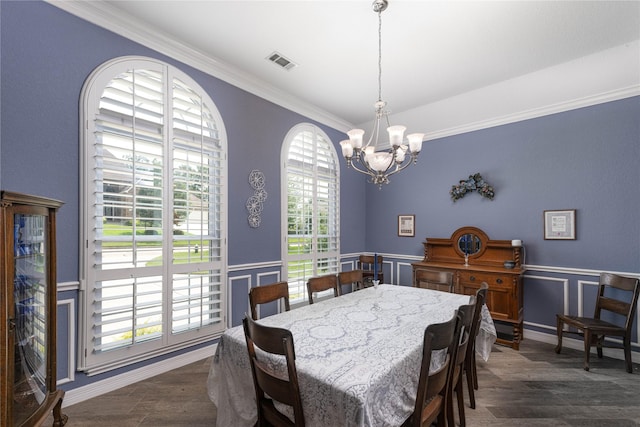 98 Victoria Dr W, Montgomery, TX 77356 - dining area featuring crown molding, a chandelier, a decorative wall, visible vents, and dark wood-style flooring