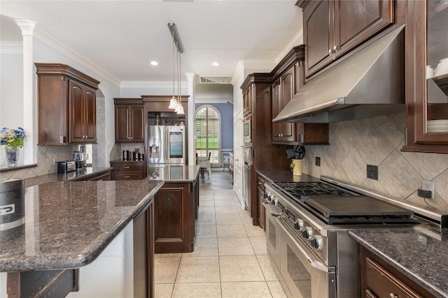 98 Victoria Dr W, Montgomery, TX 77356 - kitchen with crown molding, dark brown cabinetry, a kitchen island, under cabinet range hood, and stainless steel appliances