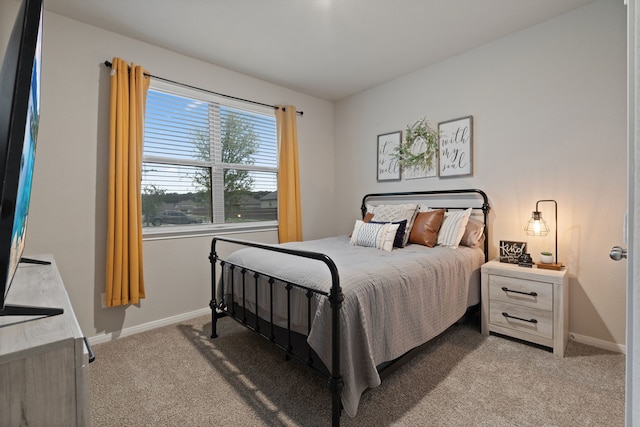 1144 Courteous Creek Dr, Montgomery, TX 77316 - bedroom featuring light carpet and baseboards