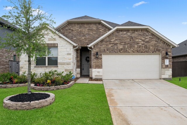 1144 Courteous Creek Dr, Montgomery, TX 77316 - french country style house with a front yard, an attached garage, driveway, stone siding, and roof with shingles