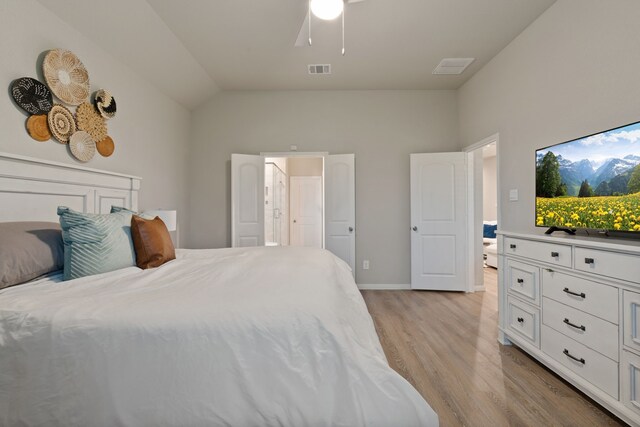 1144 Courteous Creek Dr, Montgomery, TX 77316 - bedroom with light wood finished floors, baseboards, lofted ceiling, ceiling fan, and ensuite bathroom