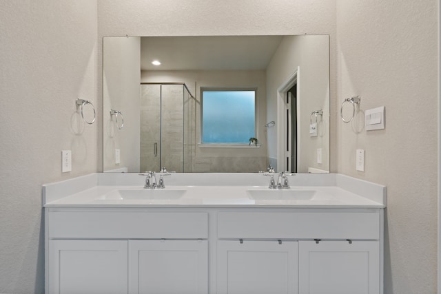 1144 Courteous Creek Dr, Montgomery, TX 77316 - bathroom featuring a stall shower, a textured wall, and double vanity