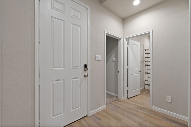 1144 Courteous Creek Dr, Montgomery, TX 77316 - corridor with baseboards and light wood finished floors