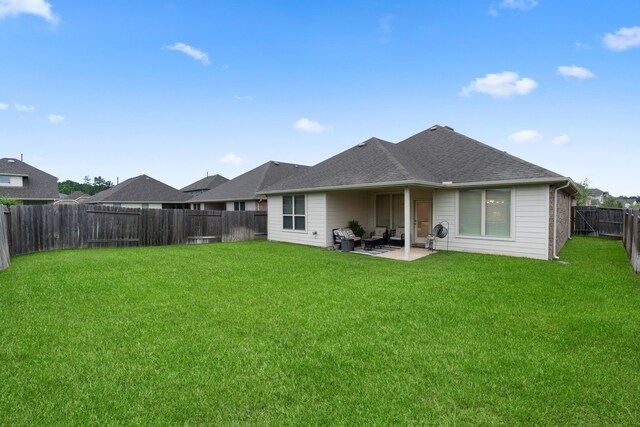 1144 Courteous Creek Dr, Montgomery, TX 77316 - back of property with a patio area and a shingled roof