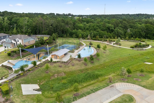 1144 Courteous Creek Dr, Montgomery, TX 77316 - view of property location with a heavily wooded area and a pool
