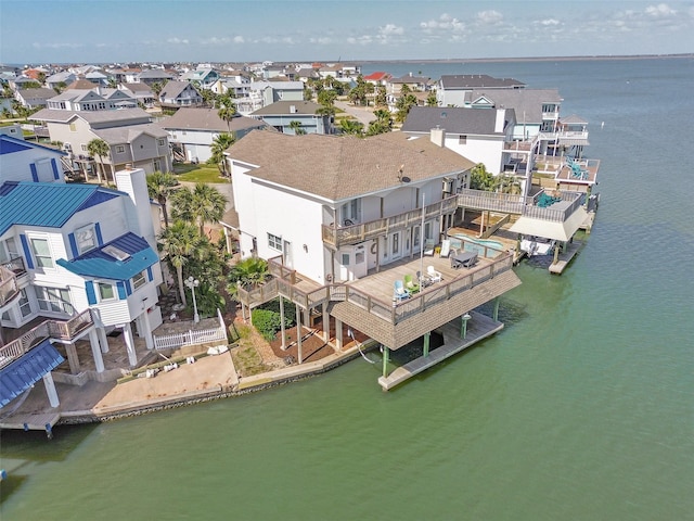 1306 Outrigger, Tiki Island, TX 77554 - aerial view of residential area with a nearby body of water
