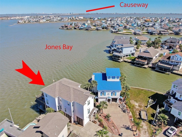 1306 Outrigger, Tiki Island, TX 77554 - aerial view of residential area with a nearby body of water