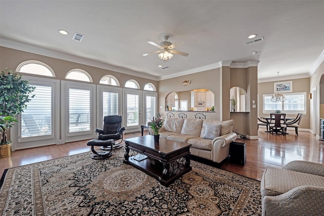 1306 Outrigger, Tiki Island, TX 77554 - living room with crown molding, a ceiling fan, wood finished floors, healthy amount of natural light, and recessed lighting
