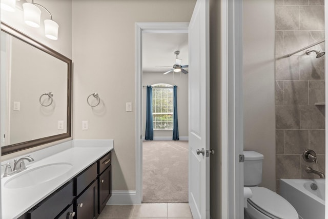 bathroom with vanity, tile patterned floors, shower / tub combination, a ceiling fan, and toilet