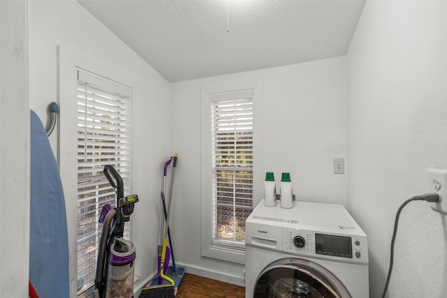 5808 Community Dr, Houston, TX 77005 - laundry area with a textured ceiling, wood finished floors, washer / dryer, and a healthy amount of sunlight